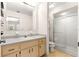 This bathroom features a vanity with storage, a toilet, and a shower with sliding glass doors at 10833 Sw 86Th Ter, Ocala, FL 34481