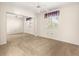 This bedroom features neutral carpet, a ceiling fan, and a mirrored sliding closet at 10833 Sw 86Th Ter, Ocala, FL 34481