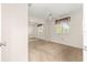 This bedroom features neutral carpet, a ceiling fan, and a mirrored sliding closet at 10833 Sw 86Th Ter, Ocala, FL 34481
