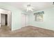Bedroom featuring light green walls, neutral carpet, and a large closet at 10833 Sw 86Th Ter, Ocala, FL 34481