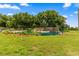 Picturesque community entrance featuring a tranquil waterfall, lush landscaping, and the welcoming Oak Run community sign at 10833 Sw 86Th Ter, Ocala, FL 34481