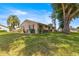 Charming home with a well-kept lawn, trimmed hedges, and a beautiful mature tree in the yard at 10833 Sw 86Th Ter, Ocala, FL 34481
