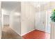 Foyer featuring tile entry, patterned wallpaper, and a view into the living spaces at 10833 Sw 86Th Ter, Ocala, FL 34481