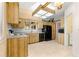Charming kitchen features bright cabinets, tile floors, and a black refrigerator at 10833 Sw 86Th Ter, Ocala, FL 34481