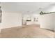 Bright living room with carpet flooring and a ceiling fan at 10833 Sw 86Th Ter, Ocala, FL 34481