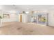 Large living room with sliding doors to a screened-in patio at 10833 Sw 86Th Ter, Ocala, FL 34481