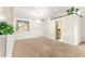 Bright living room with neutral carpet and a window for plenty of natural light at 10833 Sw 86Th Ter, Ocala, FL 34481