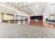 Expansive meeting space with elegant chandeliers, hardwood dance floor, and ample seating for large gatherings and community events at 10833 Sw 86Th Ter, Ocala, FL 34481