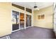 Spacious screened porch with sliding glass doors, a ceiling fan, and neutral carpeting at 10833 Sw 86Th Ter, Ocala, FL 34481