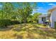 Spacious backyard featuring mature trees, a well-maintained lawn, and serene outdoor space at 10989 Sw 86Th Ave, Ocala, FL 34481