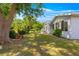 Large backyard featuring green lawn, mature trees and space for outdoor enjoyment at 10989 Sw 86Th Ave, Ocala, FL 34481