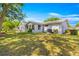 Expansive backyard featuring lush greenery, mature trees, and a well-maintained lawn at 10989 Sw 86Th Ave, Ocala, FL 34481