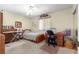 Bedroom with a bed, a desk and chair, a ceiling fan, and carpeted flooring at 10989 Sw 86Th Ave, Ocala, FL 34481