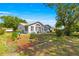 Well-maintained home exterior with a manicured lawn, landscaping, and inviting curb appeal at 10989 Sw 86Th Ave, Ocala, FL 34481