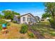 Charming home exterior with landscaping, a well-maintained lawn, and inviting curb appeal at 10989 Sw 86Th Ave, Ocala, FL 34481