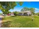 Charming single story home with well-manicured lawn, mature trees, and inviting curb appeal at 10989 Sw 86Th Ave, Ocala, FL 34481