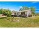 The house features a well-maintained lawn, landscaping, and attractive curb appeal at 10989 Sw 86Th Ave, Ocala, FL 34481