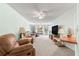 Relaxing living room with plush seating and ample natural light, perfect for unwinding at 10989 Sw 86Th Ave, Ocala, FL 34481
