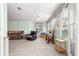 Cozy living room boasts plush carpeting, plentiful seating, and large windows for natural light at 10989 Sw 86Th Ave, Ocala, FL 34481