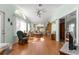 Light-filled Florida room boasts vaulted ceilings, a ceiling fan, and sliding doors to the exterior at 10989 Sw 86Th Ave, Ocala, FL 34481