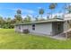 Grey house showing the back with an AC Unit and small windows at 11065 Ne 42Nd St, Silver Springs, FL 34488
