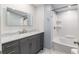 Bathroom featuring a vanity with granite top, shower and tub at 11065 Ne 42Nd St, Silver Springs, FL 34488