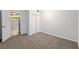 Bedroom with neutral carpet, double closet, and wood look floors in view at 11065 Ne 42Nd St, Silver Springs, FL 34488