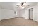 Spacious bedroom with neutral carpet and a ceiling fan at 11065 Ne 42Nd St, Silver Springs, FL 34488