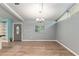Open dining room with light gray walls and wood floors at 11065 Ne 42Nd St, Silver Springs, FL 34488