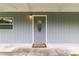 Charming gray front door with decorative glass, a welcoming entrance to a cozy home at 11065 Ne 42Nd St, Silver Springs, FL 34488