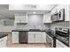 Modern kitchen featuring stylish white cabinets and stainless steel appliances at 11065 Ne 42Nd St, Silver Springs, FL 34488