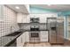 The updated kitchen features stainless appliances and a custom backsplash at 11065 Ne 42Nd St, Silver Springs, FL 34488