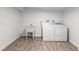 Laundry room with tile floors, utility sink, and washer/dryer at 11065 Ne 42Nd St, Silver Springs, FL 34488