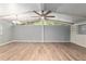 Large living room featuring a fan, open concept, and lots of natural light at 11065 Ne 42Nd St, Silver Springs, FL 34488