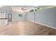 Spacious open-concept living area with neutral tones and light-colored floors at 11065 Ne 42Nd St, Silver Springs, FL 34488