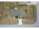 The exterior of the house showcases a sprawling yard and meticulously maintained landscaping at 13645 Se 42 Ave, Summerfield, FL 34491