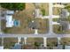 Overview of a neighborhood displaying houses with well-kept yards, pools, and driveways at 13645 Se 42 Ave, Summerfield, FL 34491