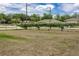 A rear view of the property's back and side yards at 13645 Se 42 Ave, Summerfield, FL 34491