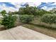 Chain-link fence with mature flowering bushes at 13645 Se 42 Ave, Summerfield, FL 34491