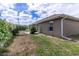 A view of the fence line and house exterior at 13645 Se 42 Ave, Summerfield, FL 34491