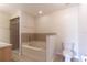 Bathroom featuring a large bathtub, shower, and toilet at 13645 Se 42 Ave, Summerfield, FL 34491