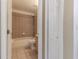 Neutral bathroom featuring tile shower over tub combo and a single sink vanity at 13645 Se 42 Ave, Summerfield, FL 34491