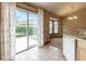 Bright dining area with sliding glass doors to the patio and view of the backyard at 13645 Se 42 Ave, Summerfield, FL 34491