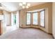 Open dining area with large windows and a door with access to outdoor living at 13645 Se 42 Ave, Summerfield, FL 34491