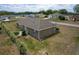 The exterior features a well-maintained yard with a charming fence and lush greenery for added privacy at 13645 Se 42 Ave, Summerfield, FL 34491