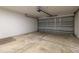 Spacious two car garage with an automatic door and painted walls at 13645 Se 42 Ave, Summerfield, FL 34491