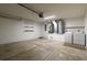 Functional garage with a water heater, washer, dryer and utility sink at 13645 Se 42 Ave, Summerfield, FL 34491