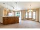 Open-concept kitchen with a breakfast bar, ample counter space, and a full suite of appliances, perfect for culinary enthusiasts at 13645 Se 42 Ave, Summerfield, FL 34491