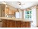 Cozy kitchen features a breakfast bar and sliding doors, providing easy access to the outdoor living space at 13645 Se 42 Ave, Summerfield, FL 34491