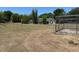 Expansive backyard with a chicken coop and ample space for outdoor activities and gardening at 15069 Se 73Rd Ave, Summerfield, FL 34491